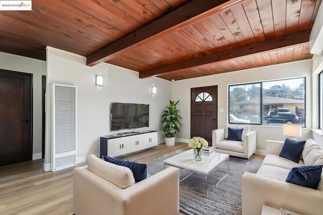 living room with wooden ceiling, beam ceiling, and light hardwood / wood-style flooring