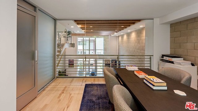 home office with light hardwood / wood-style floors