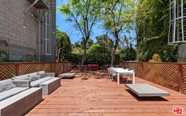 deck with an outdoor hangout area