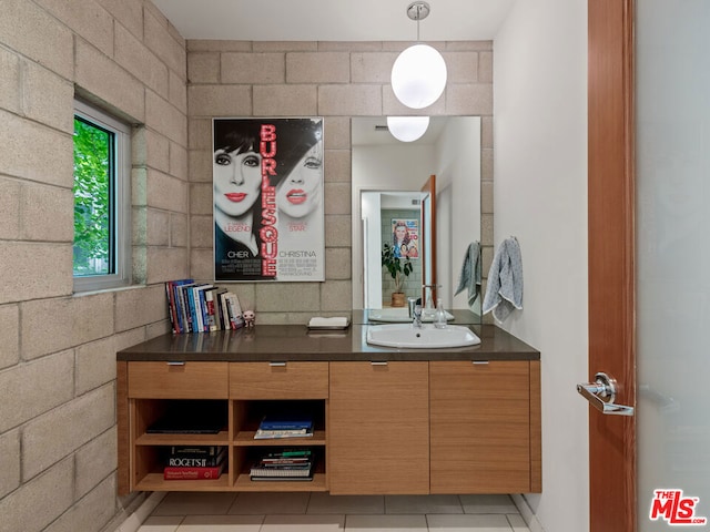 bathroom with vanity and tile patterned flooring