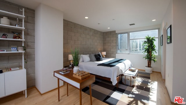 bedroom with light hardwood / wood-style flooring