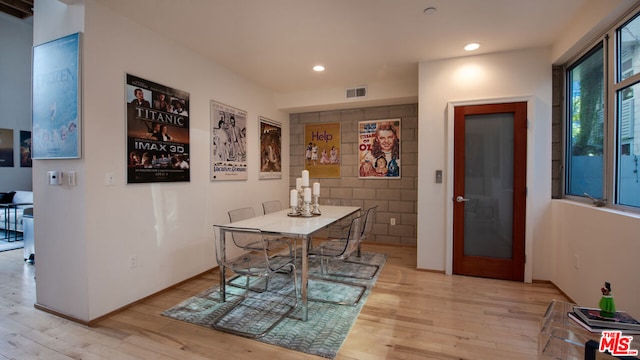 dining space with light hardwood / wood-style floors