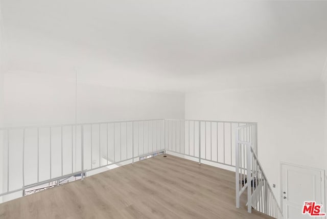 empty room with light hardwood / wood-style flooring