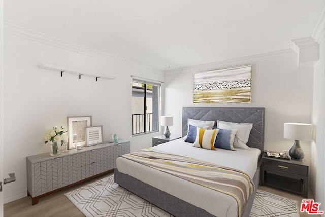 bedroom with ornamental molding and light hardwood / wood-style flooring