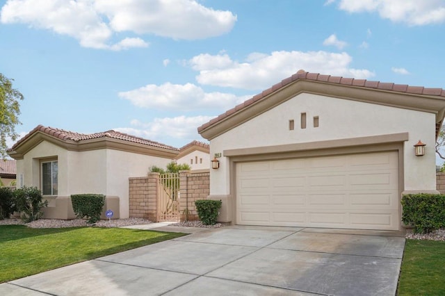 mediterranean / spanish home with a garage and a front yard