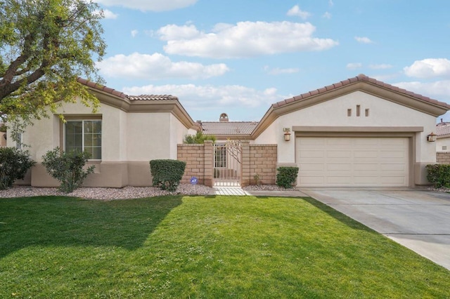 mediterranean / spanish home with a garage and a front lawn