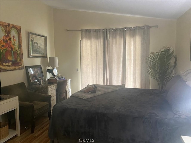 bedroom with wood finished floors