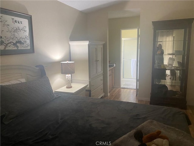 bedroom with light wood-type flooring