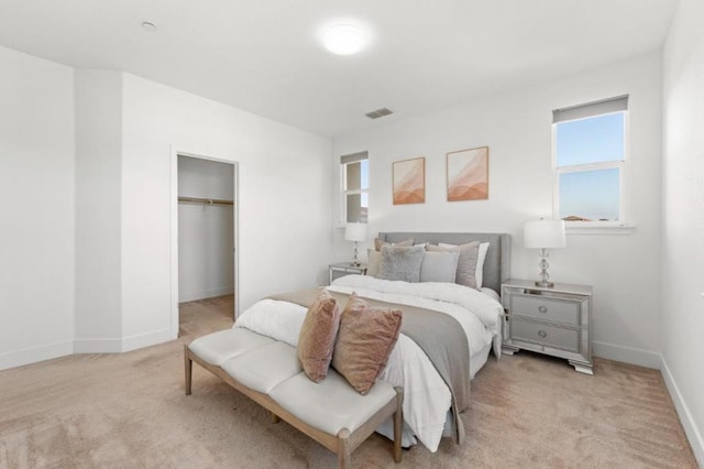 carpeted bedroom with a closet