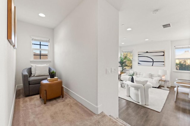 living area with light hardwood / wood-style flooring