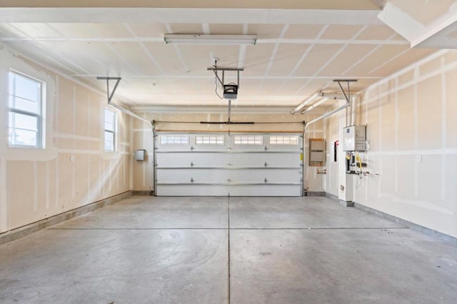 garage featuring a garage door opener and electric panel