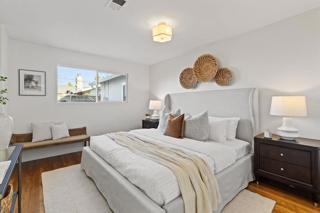 bedroom with hardwood / wood-style floors