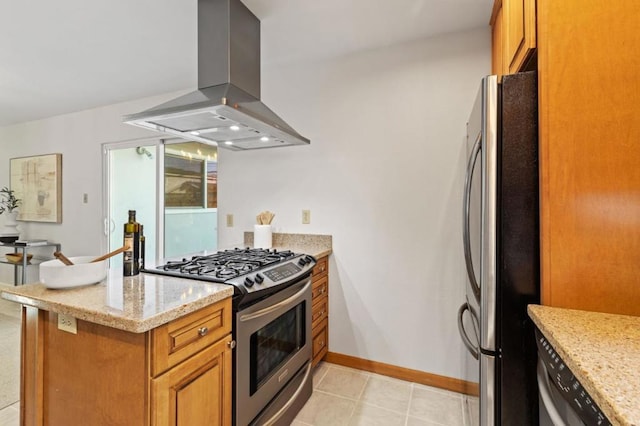 kitchen featuring island range hood, light stone countertops, kitchen peninsula, and appliances with stainless steel finishes