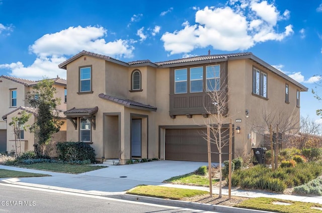 mediterranean / spanish-style home featuring a garage