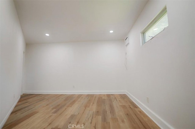 unfurnished room with light wood-type flooring