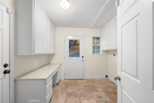 laundry room featuring cabinets and hookup for an electric dryer