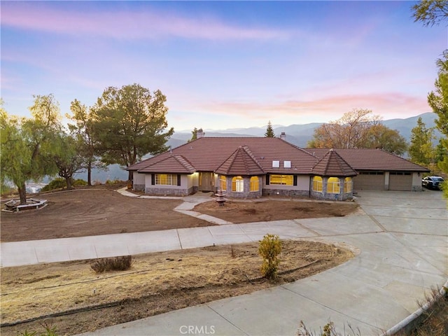 view of front of home featuring a carport and a mountain view