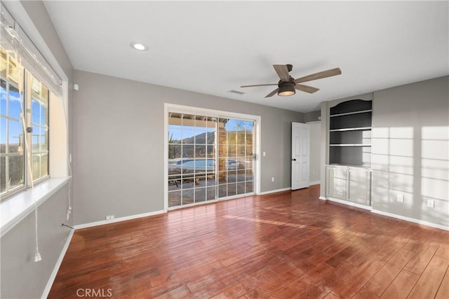 interior space featuring hardwood / wood-style flooring, ceiling fan, and plenty of natural light