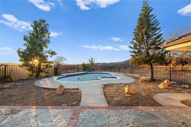 view of pool with a mountain view and a patio area