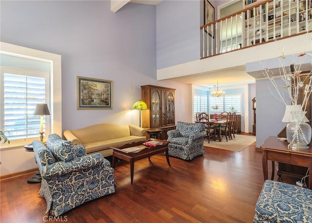 living room with a high ceiling and wood-type flooring