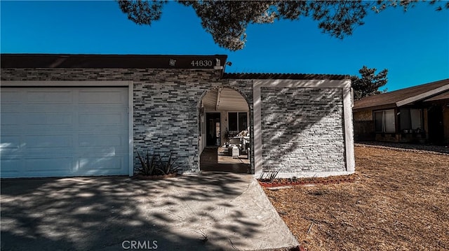 ranch-style home with a garage