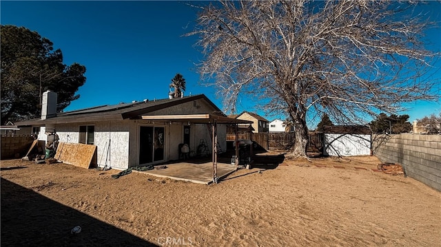 back of property featuring a patio