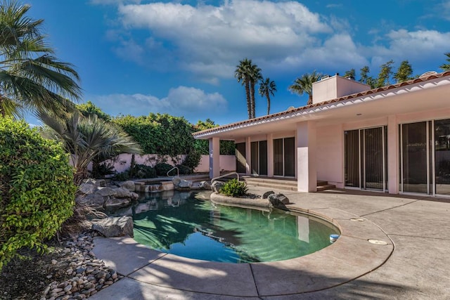 view of pool featuring a patio