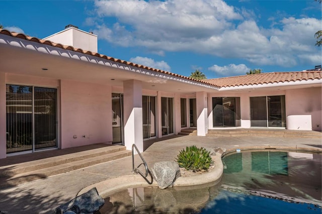 back of house with a patio area