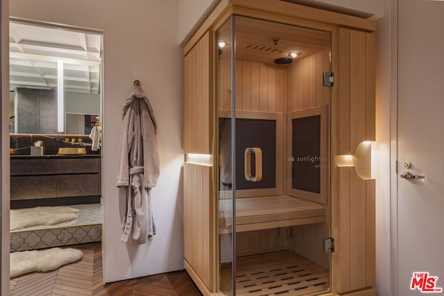 view of sauna featuring parquet floors