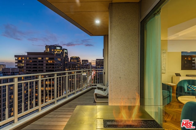 view of balcony at dusk