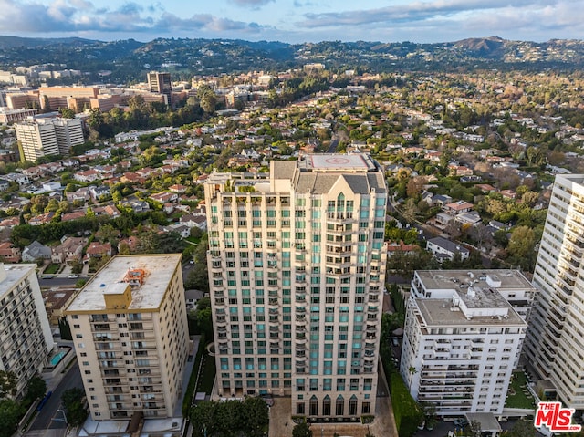 birds eye view of property with a mountain view