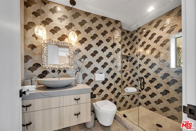 bathroom with a shower, tile patterned floors, toilet, and vanity