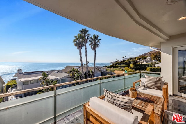 balcony featuring a water view