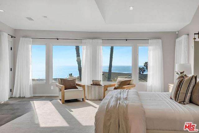 bedroom featuring a water view