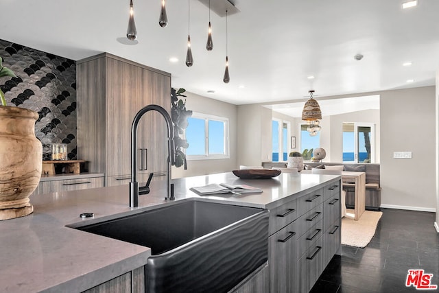 kitchen featuring decorative light fixtures and sink