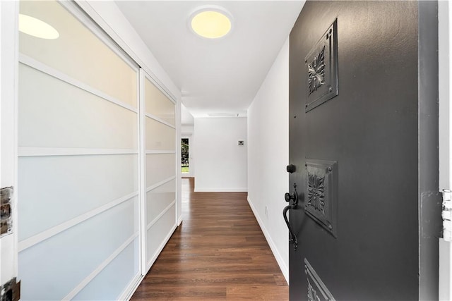 hall with dark wood-type flooring