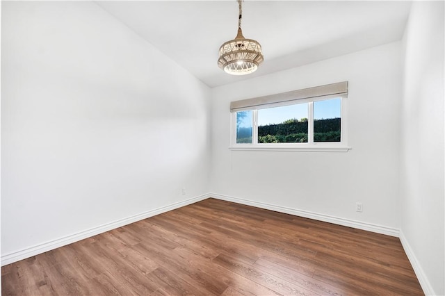 spare room with wood-type flooring