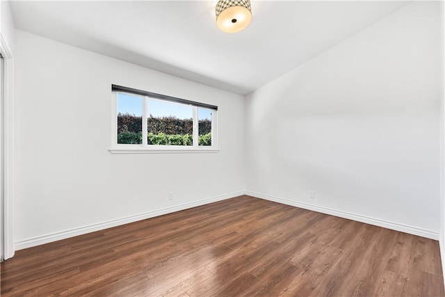 unfurnished room featuring dark hardwood / wood-style floors