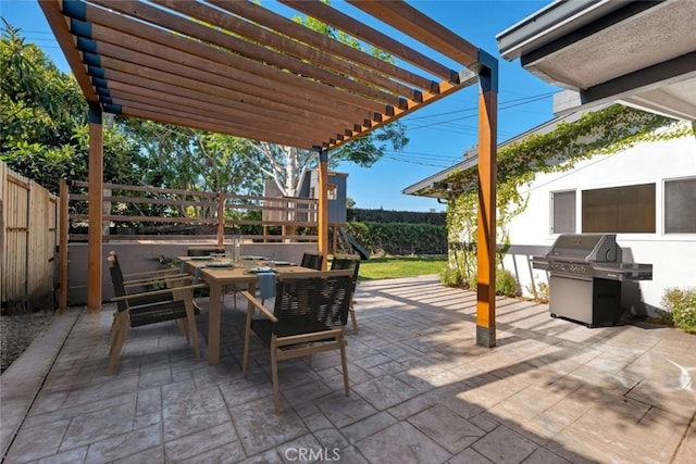 view of patio / terrace featuring area for grilling and a pergola