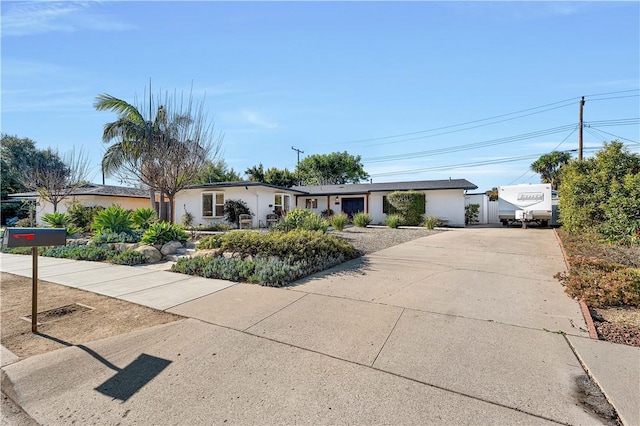 single story home with a garage