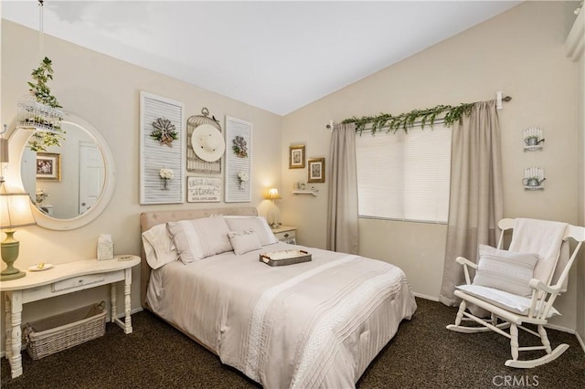 carpeted bedroom with vaulted ceiling