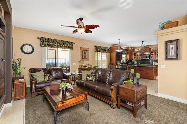 tiled living room featuring ceiling fan