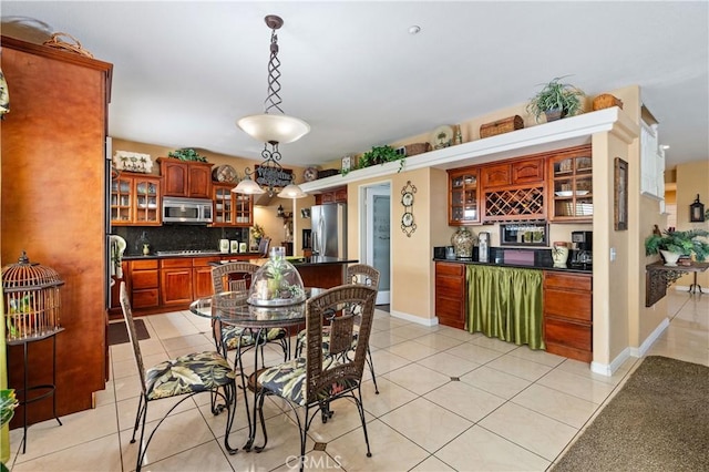 dining room with light tile patterned flooring and bar