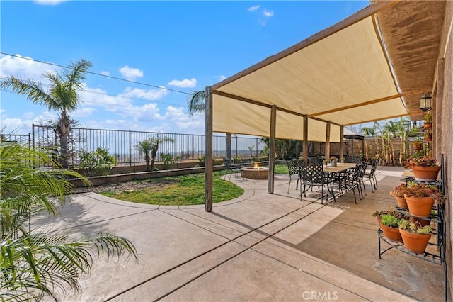 view of patio with an outdoor fire pit