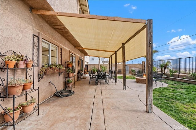 view of patio featuring an outdoor fire pit