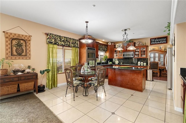 dining space with light tile patterned floors