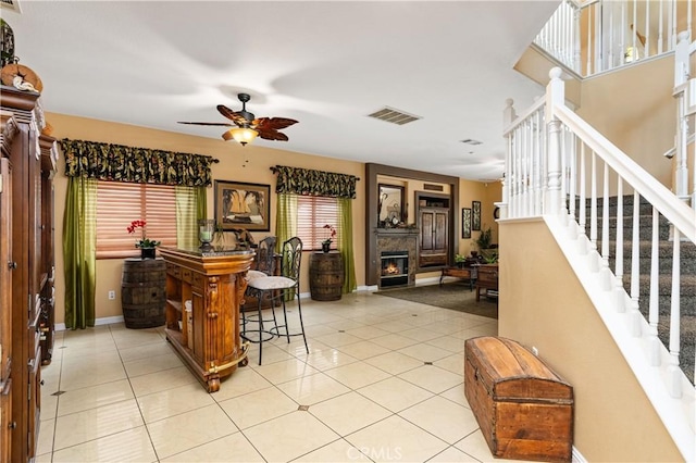 kitchen featuring light tile patterned floors and ceiling fan