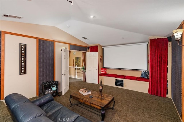 carpeted home theater room featuring lofted ceiling