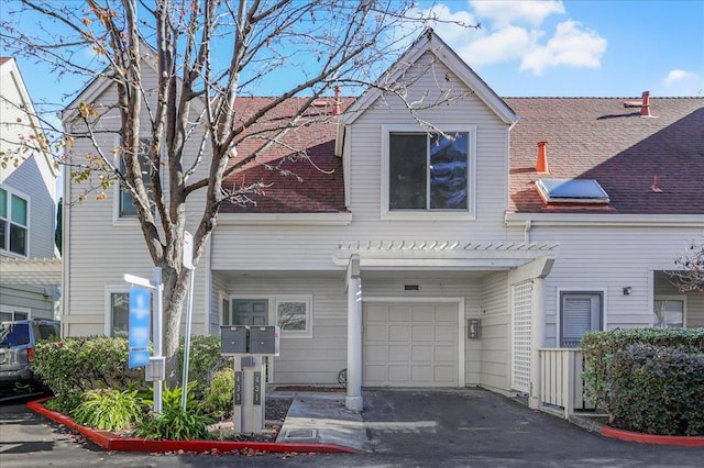 townhome / multi-family property featuring a garage