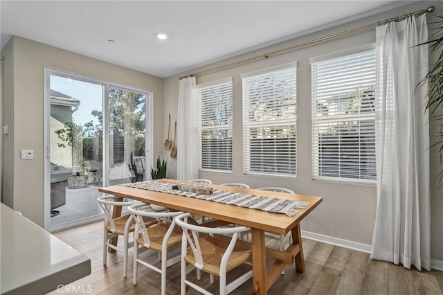 dining area with hardwood / wood-style flooring